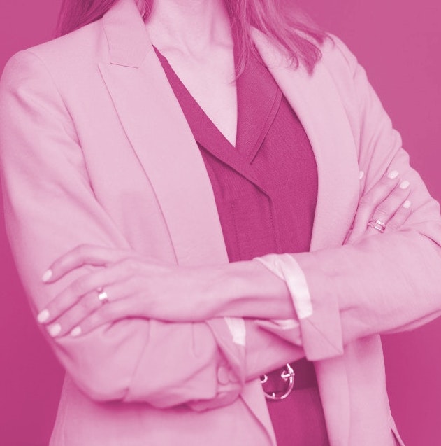 A businesswoman standing with her arms folded